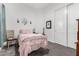 Cozy bedroom features neutral walls, grey carpet, and a decorative bird tree next to a twin bed at 22323 E Via Del Jardin --, Queen Creek, AZ 85142
