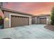 A three car garage with concrete driveway provides plenty of parking at 22323 E Via Del Jardin --, Queen Creek, AZ 85142