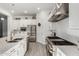 Bright and modern kitchen featuring stainless steel appliances, a large island, and white cabinetry at 22323 E Via Del Jardin --, Queen Creek, AZ 85142