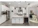 Modern kitchen with white cabinets, stainless steel appliances, and a center island with a wine fridge at 22323 E Via Del Jardin --, Queen Creek, AZ 85142
