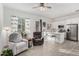 Bright living room seamlessly flows into a modern kitchen with stainless steel appliances at 22323 E Via Del Jardin --, Queen Creek, AZ 85142