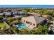 An aerial view of a backyard with a sparkling pool and hot tub, surrounded by lush landscaping at 22323 E Via Del Jardin --, Queen Creek, AZ 85142