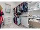 Walk-in closet with built-in shelves and racks for organizing clothing and maximizing storage space at 22323 E Via Del Jardin --, Queen Creek, AZ 85142