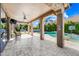 Spacious covered patio with tile floor, perfect for outdoor entertaining near the pool and yard at 2282 E Zion Way, Chandler, AZ 85249