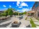 Resort-style backyard with pool, outdoor kitchen, fire pit, and patio at 2282 E Zion Way, Chandler, AZ 85249