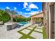 Beautiful outdoor space with a pool, kitchen, patio, and artificial grass at 2282 E Zion Way, Chandler, AZ 85249