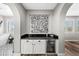 Butler's pantry area with wine fridge and white cabinets at 2282 E Zion Way, Chandler, AZ 85249