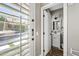 Bright half bath featuring vanity, mirror, and window with backyard pool view at 2282 E Zion Way, Chandler, AZ 85249