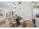 Dining room featuring high ceilings, tall windows and doors, and sleek wood floors at 2282 E Zion Way, Chandler, AZ 85249