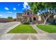 Charming two-story home boasts a landscaped front yard and a welcoming entrance with arched detailing at 2282 E Zion Way, Chandler, AZ 85249