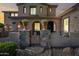 Charming front gate with stone pillars and potted flowers welcomes you home at 2282 E Zion Way, Chandler, AZ 85249