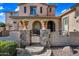 Charming front gate with stone pillars and potted flowers welcomes you home at 2282 E Zion Way, Chandler, AZ 85249