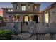 Charming front gate with stone pillars and potted flowers welcomes you home at 2282 E Zion Way, Chandler, AZ 85249