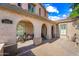 Inviting front porch with arched entryways and brick paving at 2282 E Zion Way, Chandler, AZ 85249