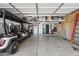 Spacious garage with overhead storage racks, providing ample room for vehicles and organization at 2282 E Zion Way, Chandler, AZ 85249