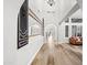 Bright hallway featuring archways, wood floors, and decorative wall mirrors for a luxurious ambiance at 2282 E Zion Way, Chandler, AZ 85249