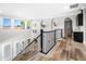 Hallway featuring modern black railing and decorative deer heads on the wall at 2282 E Zion Way, Chandler, AZ 85249