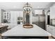 Open-concept kitchen with large island, stainless steel appliances, and white cabinets at 2282 E Zion Way, Chandler, AZ 85249