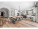 Bright open kitchen features a wooden table and black-and-white checkered chairs, perfect for casual dining at 2282 E Zion Way, Chandler, AZ 85249