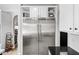 Stainless steel refrigerator with white cabinets and black countertop at 2282 E Zion Way, Chandler, AZ 85249