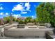 Spacious outdoor kitchen and dining space with built-in grill and shaded seating at 2282 E Zion Way, Chandler, AZ 85249