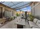 Cozy backyard patio with stylish furniture, pavers, and covered pergola at 2282 E Zion Way, Chandler, AZ 85249