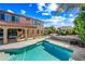 Inviting outdoor pool and patio with a complete outdoor kitchen and dining area at 2282 E Zion Way, Chandler, AZ 85249