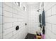 Shower features sleek tiling, black fixtures, and built-in shelving at 2282 E Zion Way, Chandler, AZ 85249