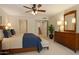 Bedroom featuring neutral tones, a ceiling fan and an ensuite bathroom at 2313 S Grandview Ave, Tempe, AZ 85282