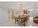 A well lit dining area featuring tile floors, chandelier lighting, and staircase at 2313 S Grandview Ave, Tempe, AZ 85282