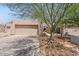 Home exterior with two-car garage, desert landscaping, and gated courtyard at 2313 S Grandview Ave, Tempe, AZ 85282