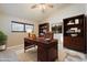 Spacious office with built in shelving, large desk, and carpet floors at 2313 S Grandview Ave, Tempe, AZ 85282