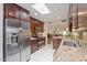 Kitchen featuring granite countertops, tile backsplash, stainless appliances, and skylight at 2313 S Grandview Ave, Tempe, AZ 85282