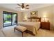 Bright main bedroom featuring sliding glass doors to the backyard and neutral decor at 2313 S Grandview Ave, Tempe, AZ 85282