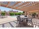 Inviting pool area with comfortable lounge chairs and shaded seating under a pergola, perfect for relaxation at 2313 S Grandview Ave, Tempe, AZ 85282