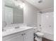 Bright bathroom with white vanity, toilet, and shower-tub with shower at 2333 W Glenrosa W Ave # 113, Phoenix, AZ 85015