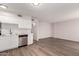 The modern kitchen features white cabinets, stainless steel dishwasher, and faucet at 2333 W Glenrosa W Ave # 113, Phoenix, AZ 85015