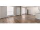 Open-concept living area with wood-look floors, ample natural light, and a fresh, modern feel at 2333 W Glenrosa W Ave # 113, Phoenix, AZ 85015
