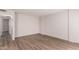 Bright living room featuring wood-look floors and a neutral color scheme at 2333 W Glenrosa W Ave # 113, Phoenix, AZ 85015
