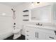 Updated bathroom with subway tile shower, floating shelves and dark fixtures at 23772 W Grove St, Buckeye, AZ 85326