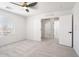 Bedroom with carpeted floor, modern door and window with blinds at 23772 W Grove St, Buckeye, AZ 85326