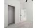Bright bedroom showcasing open closet, neutral carpet and doorway to another room at 23772 W Grove St, Buckeye, AZ 85326