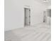 Bright bedroom with neutral carpet and white doors at 23772 W Grove St, Buckeye, AZ 85326