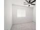 Bright bedroom with a ceiling fan and window with horizontal blinds at 23772 W Grove St, Buckeye, AZ 85326
