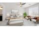 Staged main bedroom with modern decor, carpet, and natural light at 23772 W Grove St, Buckeye, AZ 85326