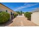 Well-maintained backyard with gravel, stone pavers and lush, mature landscaping at 2457 E Melrose St, Mesa, AZ 85213