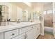 Beautiful bathroom with a double sink, white marble vanity, and a large mirror at 2457 E Melrose St, Mesa, AZ 85213