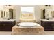 Bright bathroom featuring double vanities, garden tub, and modern fixtures at 2457 E Melrose St, Mesa, AZ 85213