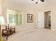 Serene bedroom with neutral walls, carpet flooring, and a window offering natural light at 2457 E Melrose St, Mesa, AZ 85213