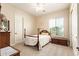 Inviting bedroom with a traditional wood frame bed, plush carpet, and lots of natural light from a window at 2457 E Melrose St, Mesa, AZ 85213